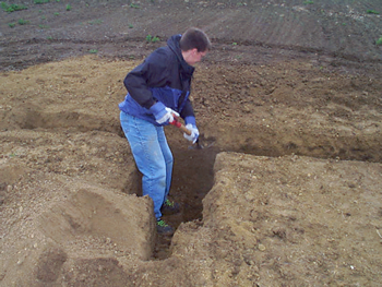 Josh Linard excavates a trench for installation of equipment at the vadose zone monitoring site.