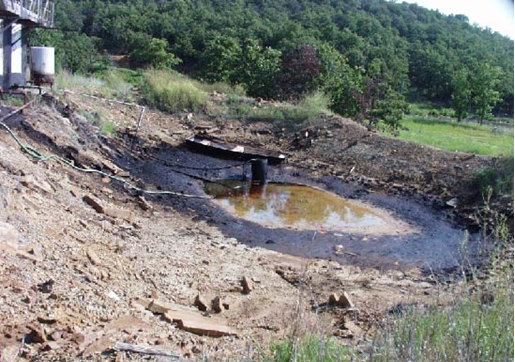 Unlined brine pit on the shore of Skiatook Lake, Okla.